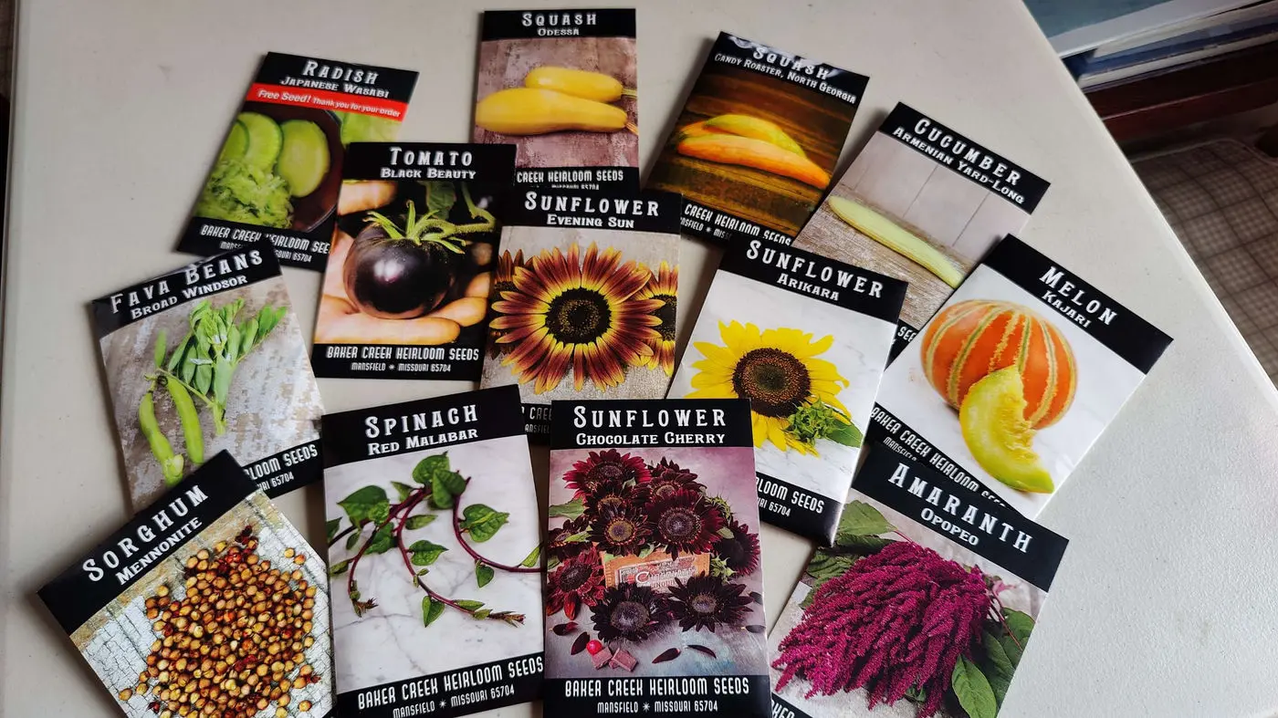 Heirloom seed packets for sunflowers, squash, tomatoes and more